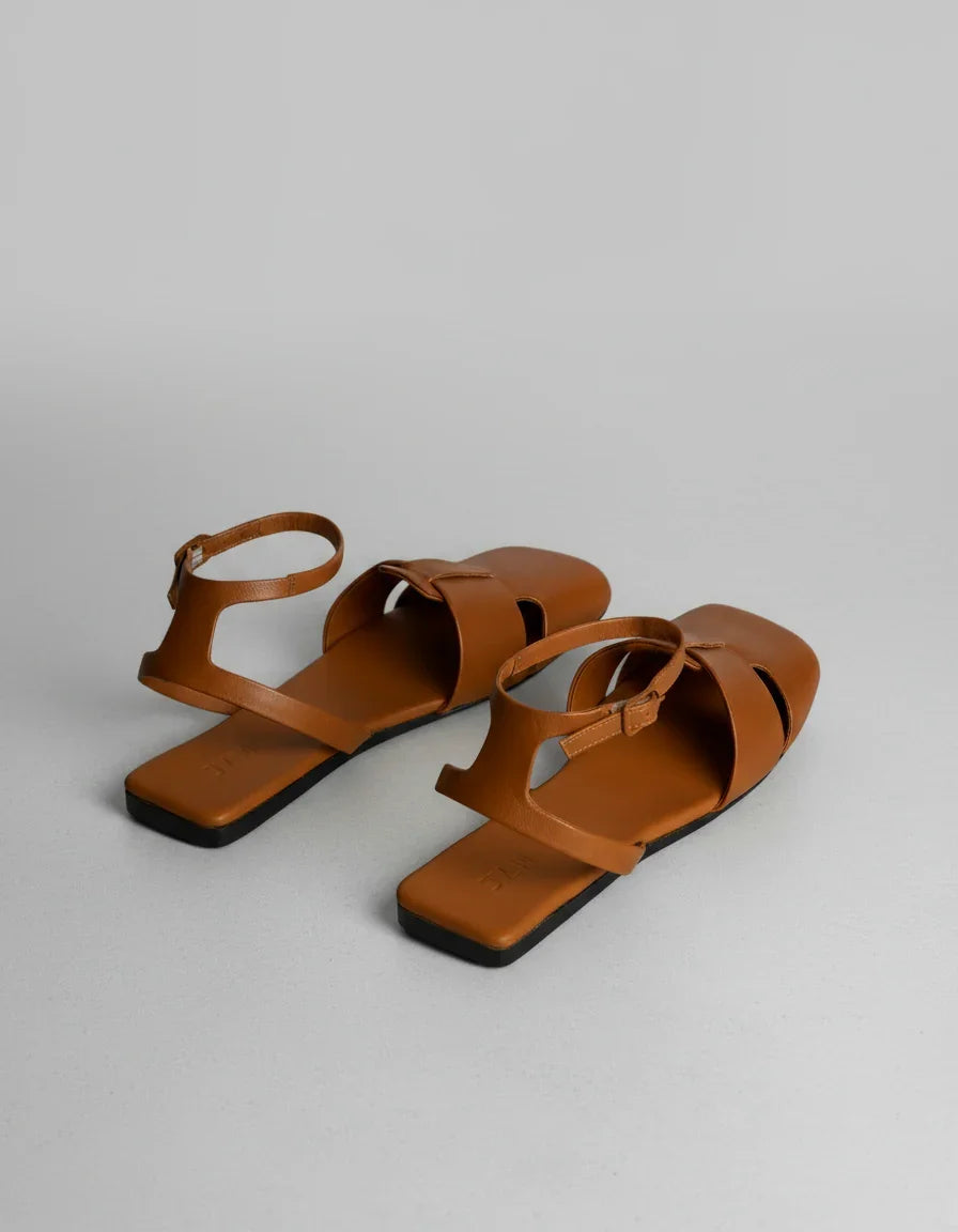 Brown leather flat sandals with ankle strap, minimalist design for women's summer style