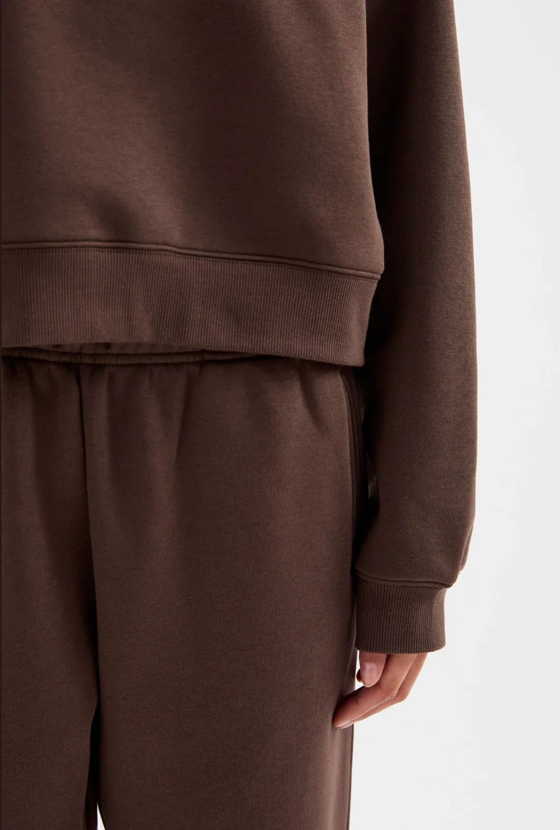 Brown women's matching sweatshirt and jogger set with ribbed cuffs and waistband