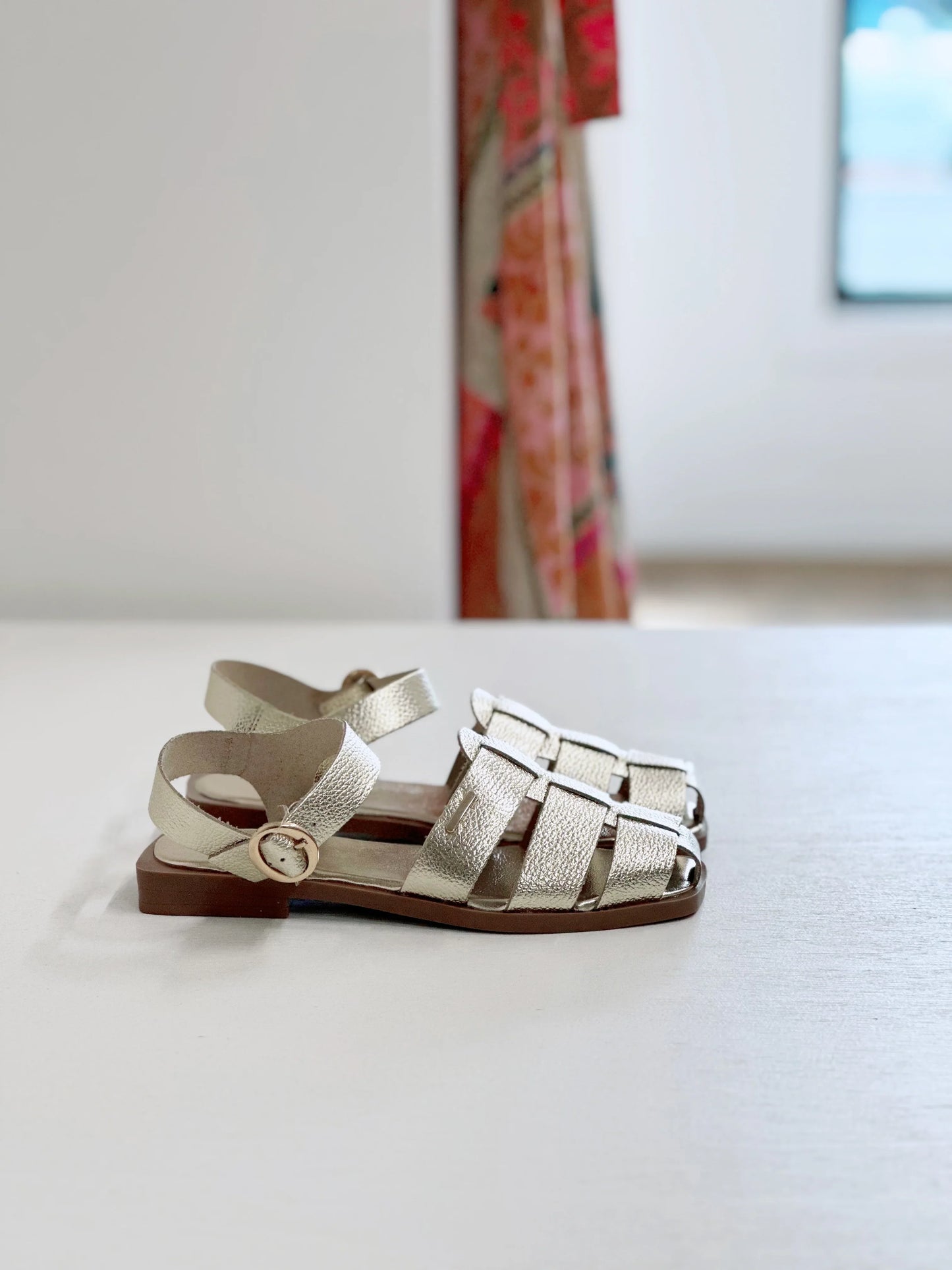 Silver strappy sandals with buckle detail, flat sole, perfect for women's summer fashion