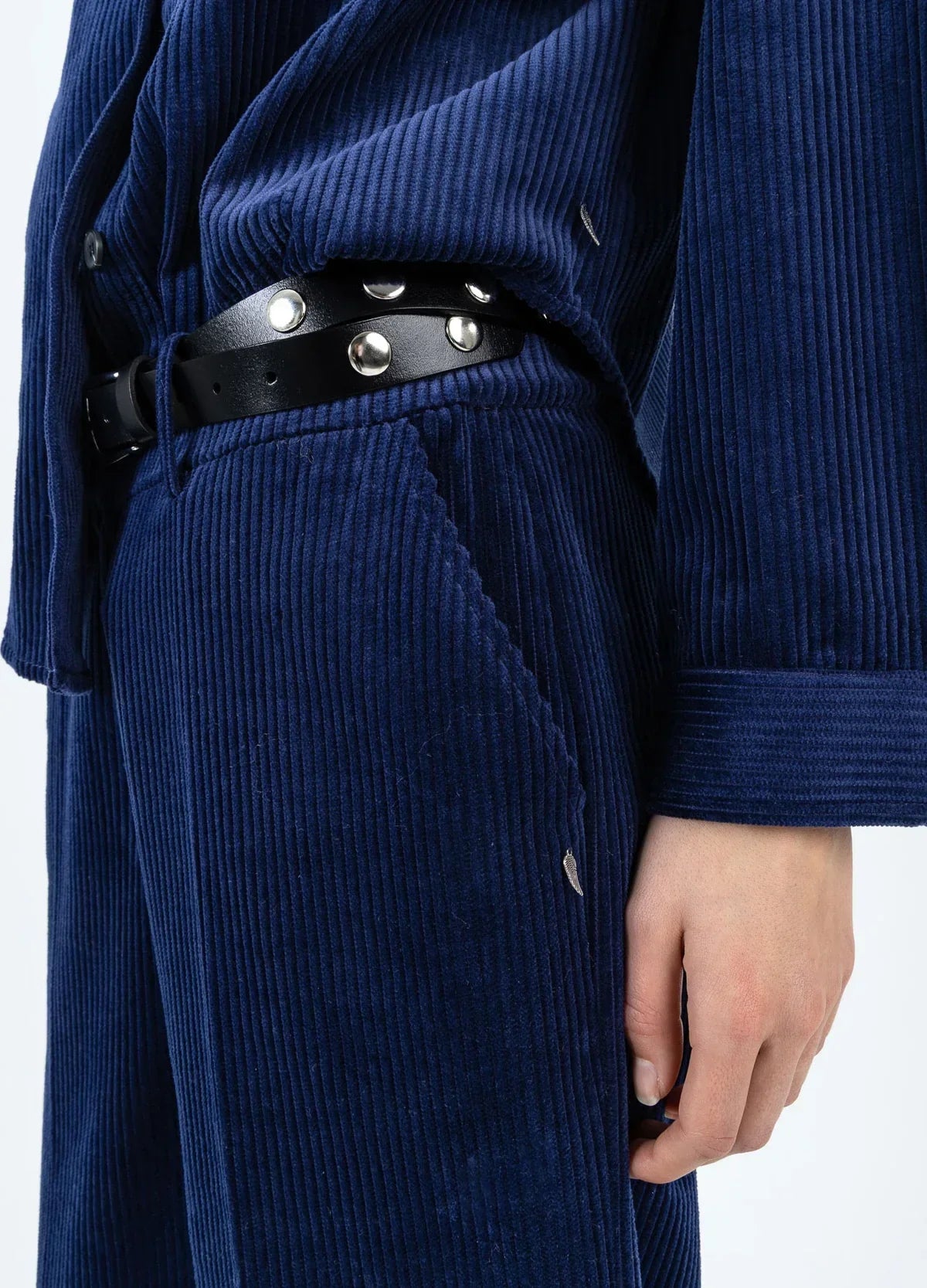 Navy corduroy outfit with studded black belt, stylish women's fashion