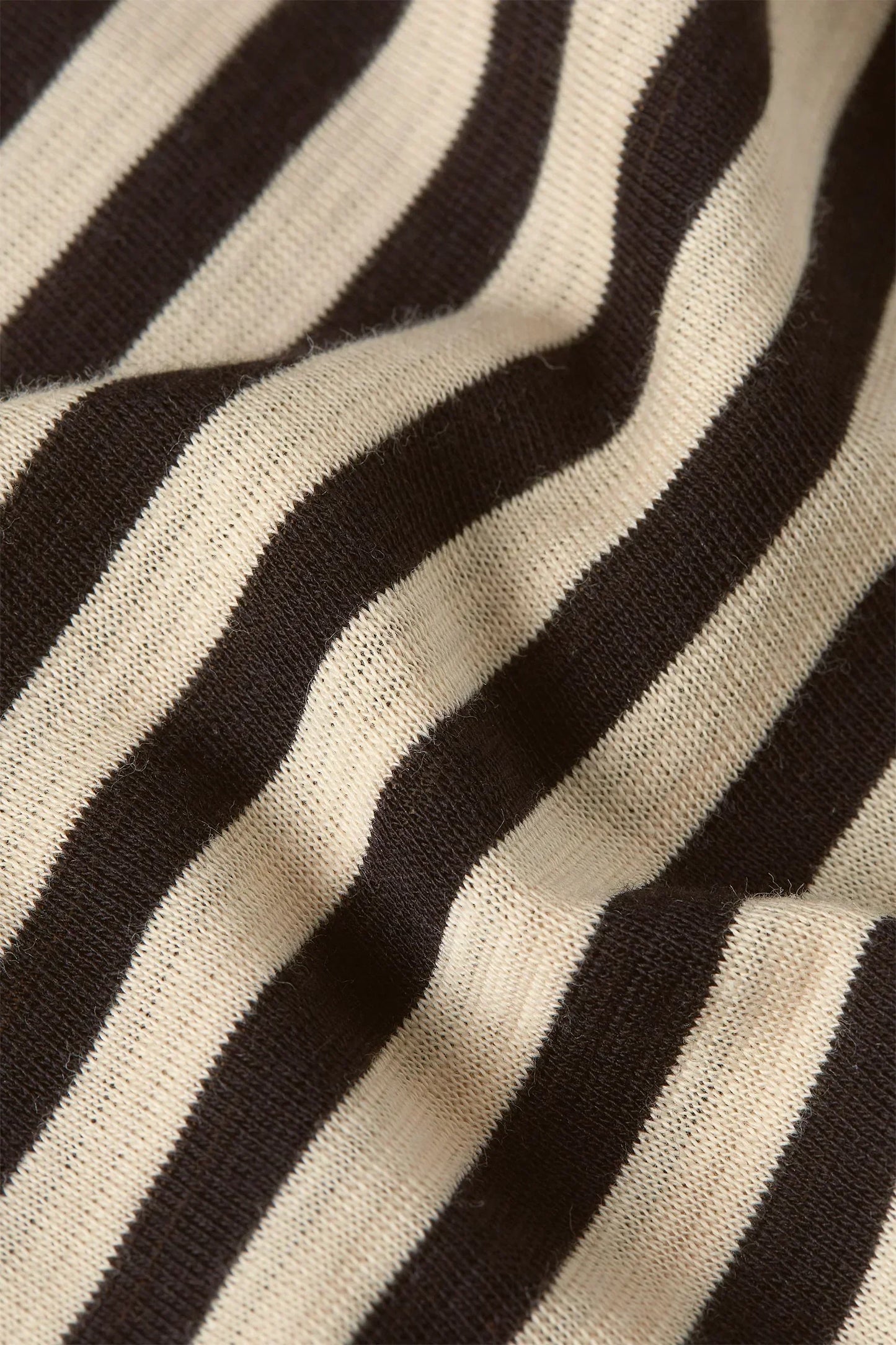 Black and cream striped knit fabric with soft texture for stylish women's fashion