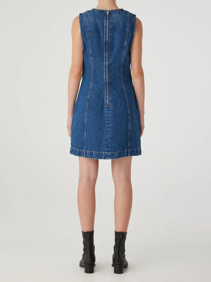 Blue denim sleeveless dress with back zipper, paired with black ankle boots
