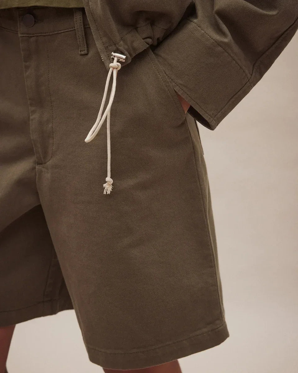 Close-up of Nobody Denim Rowan Bermuda Shorts in Safari featuring a drawstring waist detail.