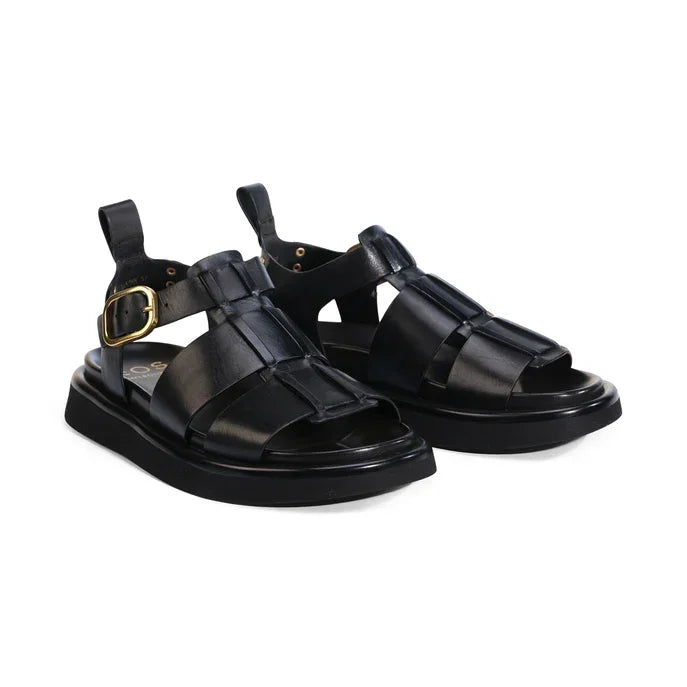 Black leather sandals with gold buckle and chunky sole