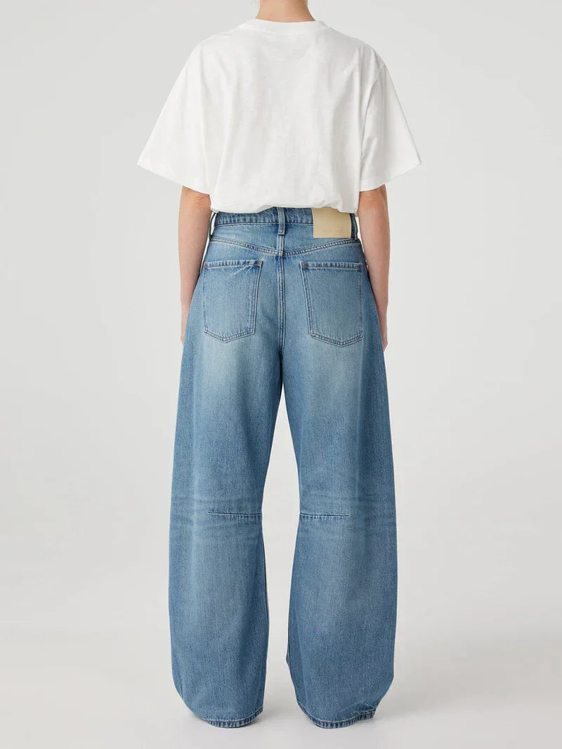 Wide-leg denim jeans with white cropped tee, stylish women's fashion