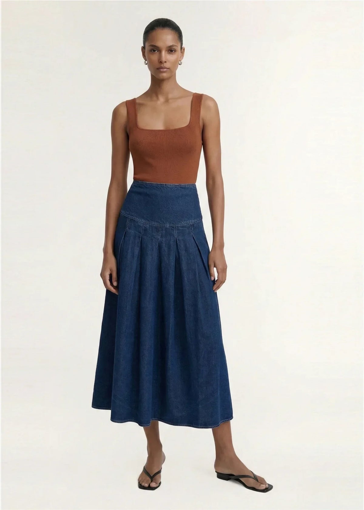 Model wearing STAPLE THE LABEL Roma Chambray Midi Skirt with a brown top.