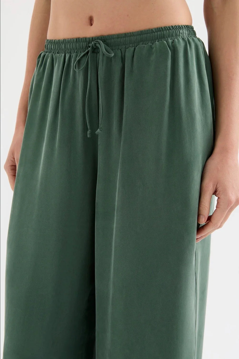 Green wide-leg women's pants with elastic waistband and drawstring detail