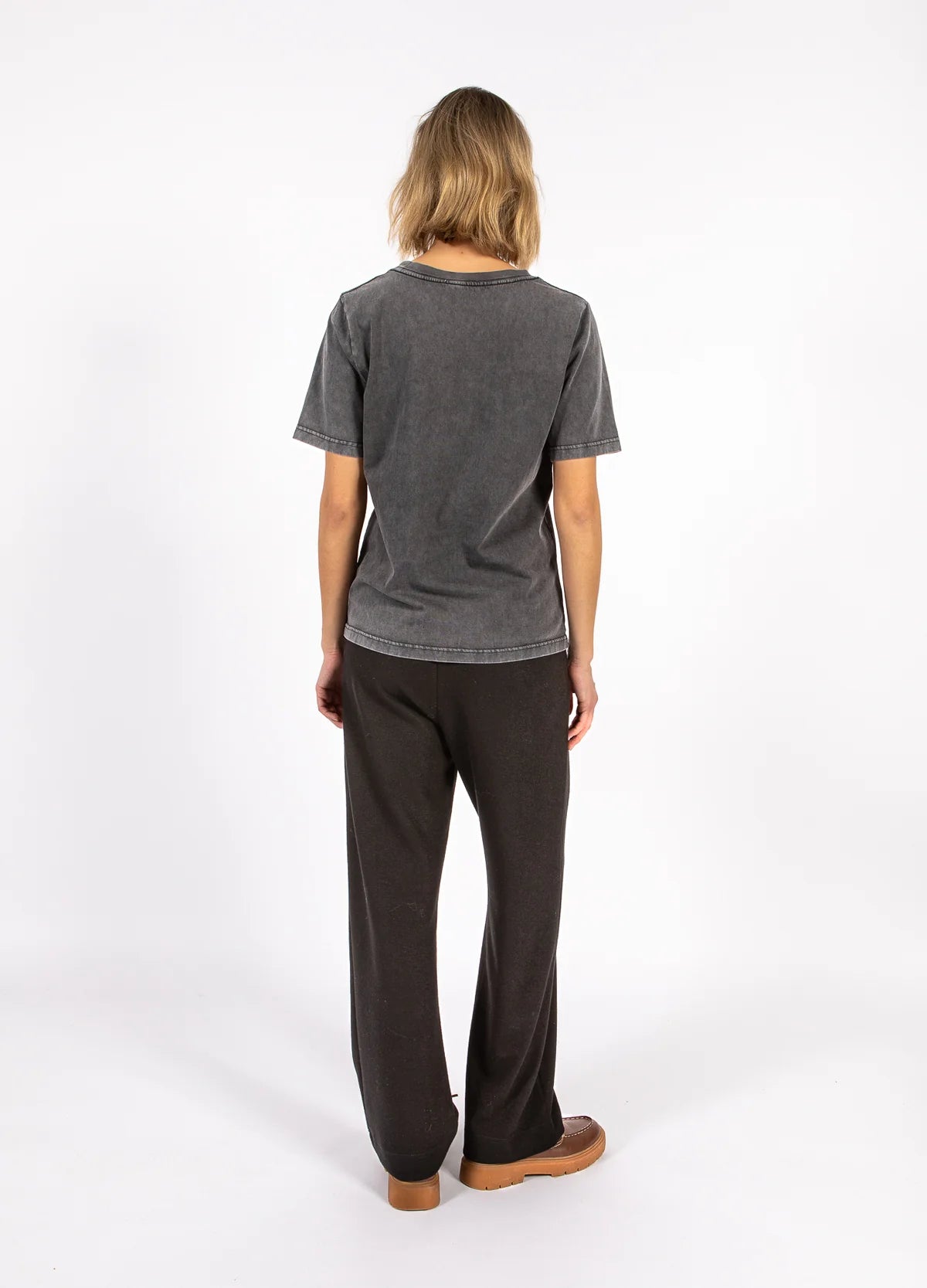 Woman modeling casual dark grey t-shirt and pants, The Tartan Fox fashion boutique