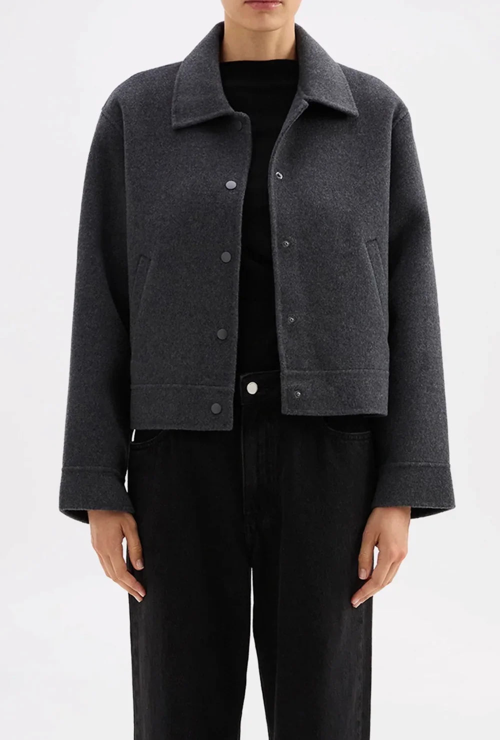 Dark grey cropped wool jacket with button front, styled with black top and jeans for women's fashion