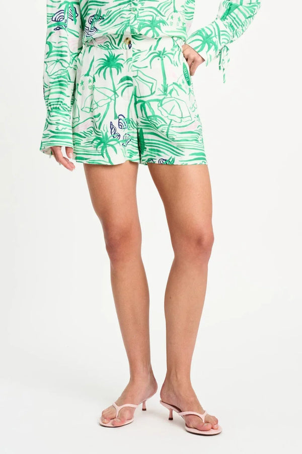 Tropical palm print shorts with matching top, styled with pink heeled sandals for summer fashion