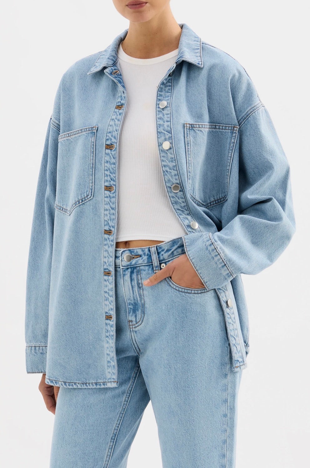 Light blue denim jacket and jeans set with white ribbed top, casual women's fashion