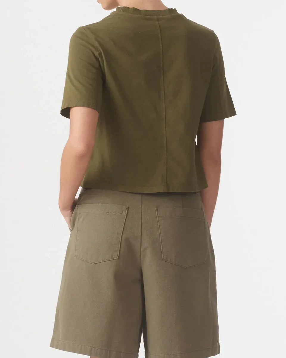Back view of a person wearing a Nobody Denim Jean Tee in Olive paired with olive shorts.