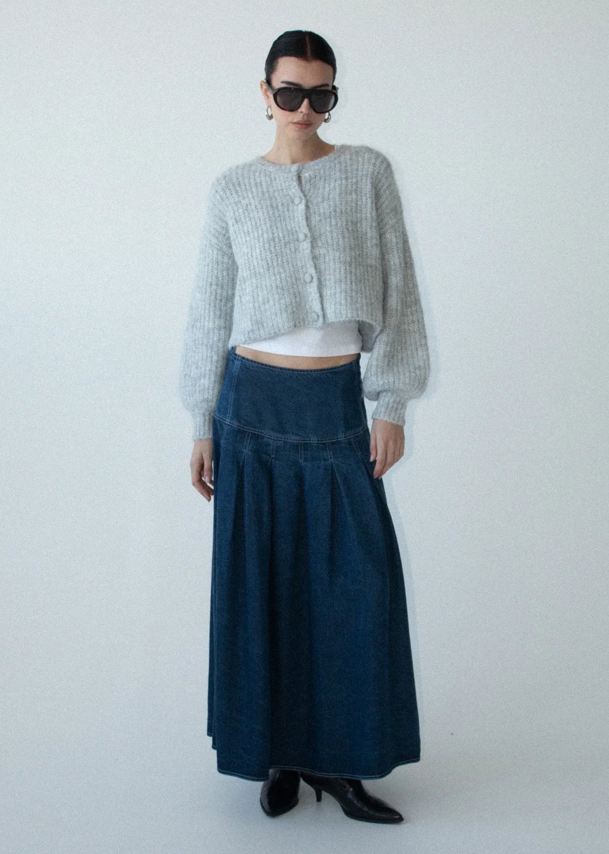 Model wearing Staple the Label Roma Chambray Midi Skirt with a grey cropped cardigan.