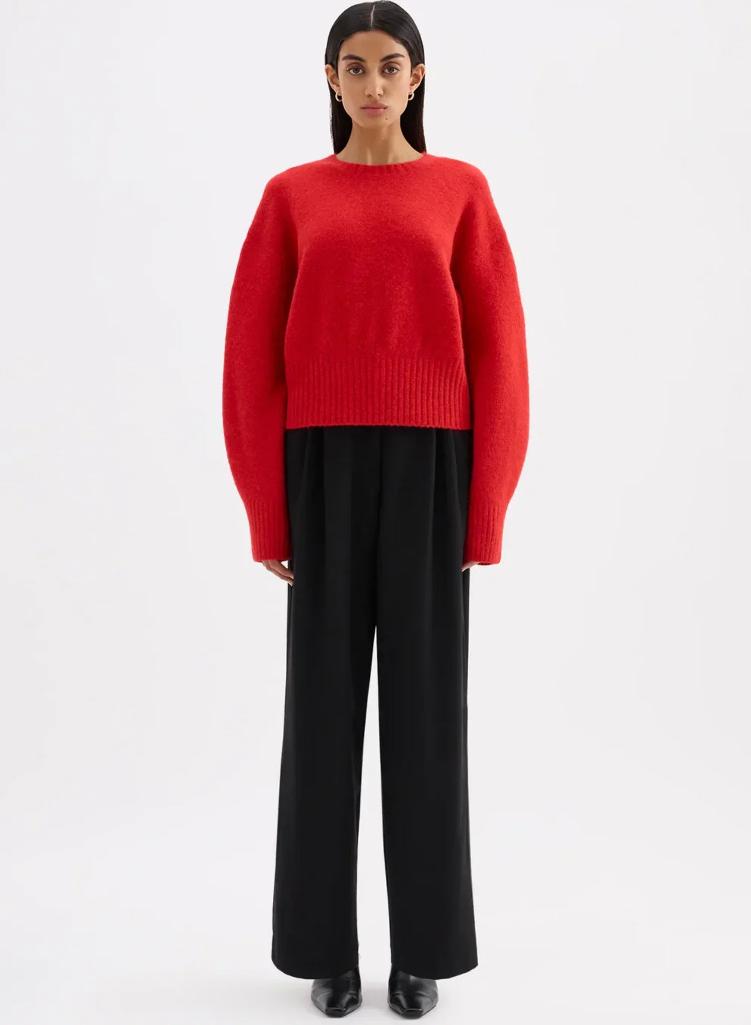 Woman in a cropped red jumper
