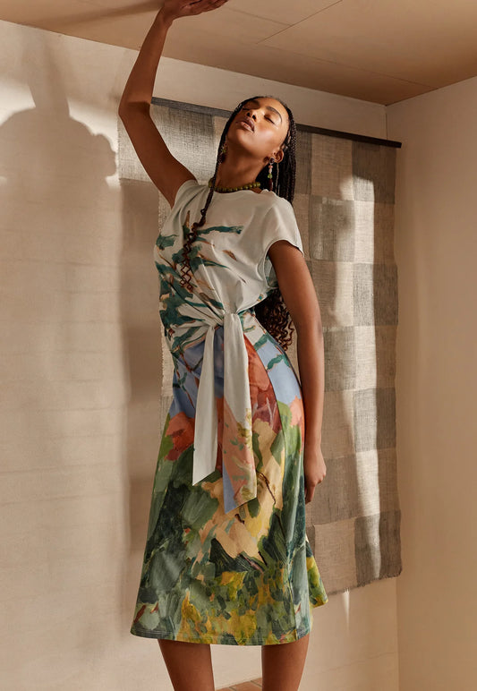 Woman wearing the NANCYBIRD Macey Dress in Pallisade with an abstract print.