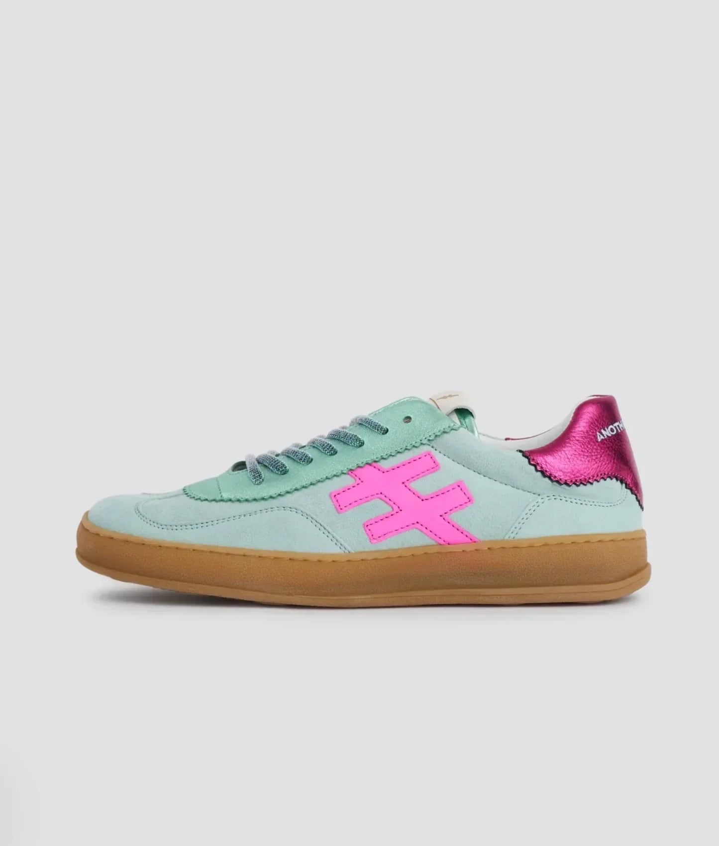 Mint green sneakers with pink logo and metallic pink heel accent