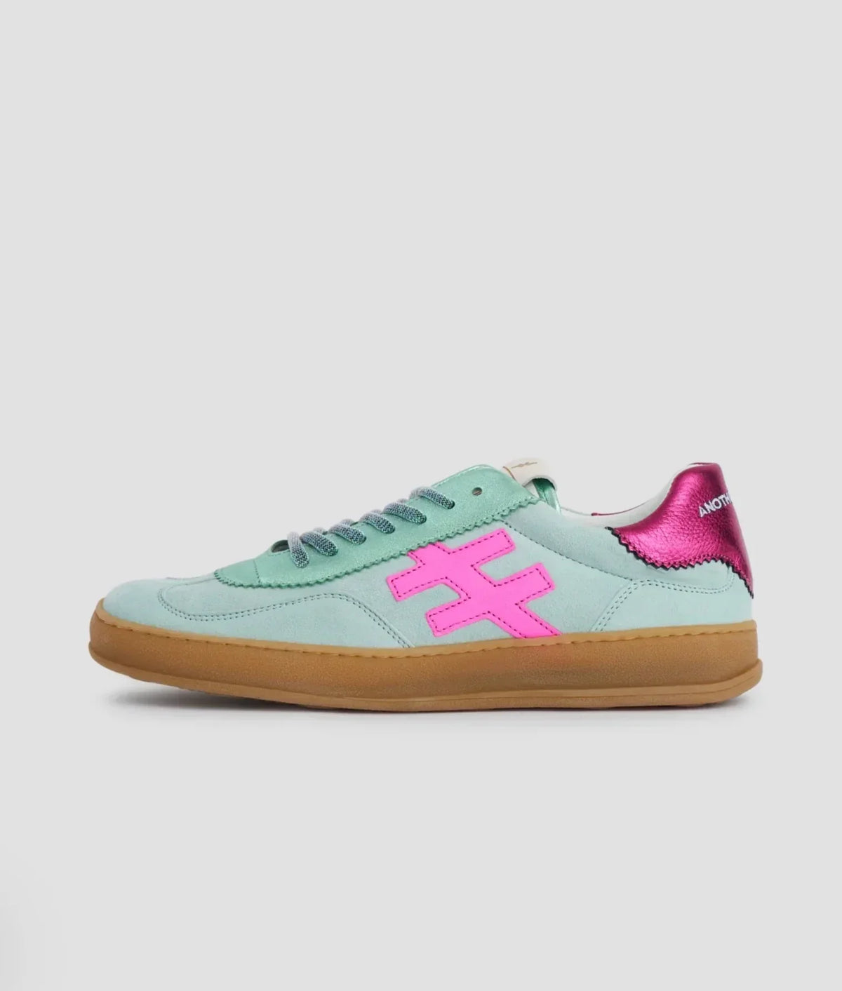 Mint green sneakers with pink logo and metallic pink heel accent