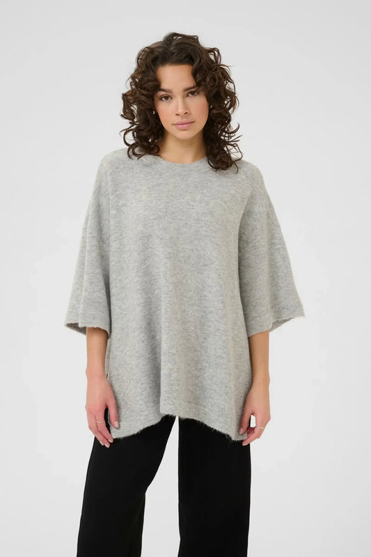 Woman in a relaxed light grey wool sweater and black pants, The Tartan Fox boutique fashion