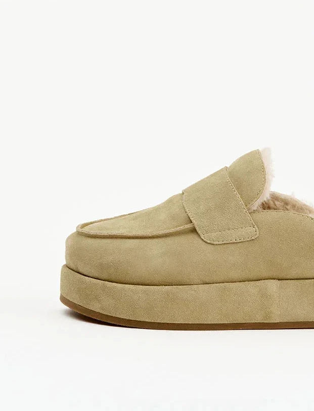 Beige suede platform mule slipper with faux fur lining for women, side view on white background