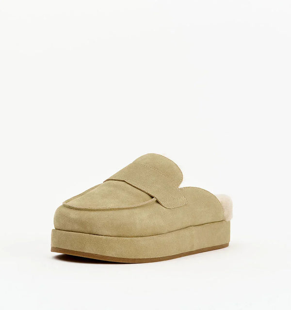 Beige suede platform mule slipper with shearling lining on white background