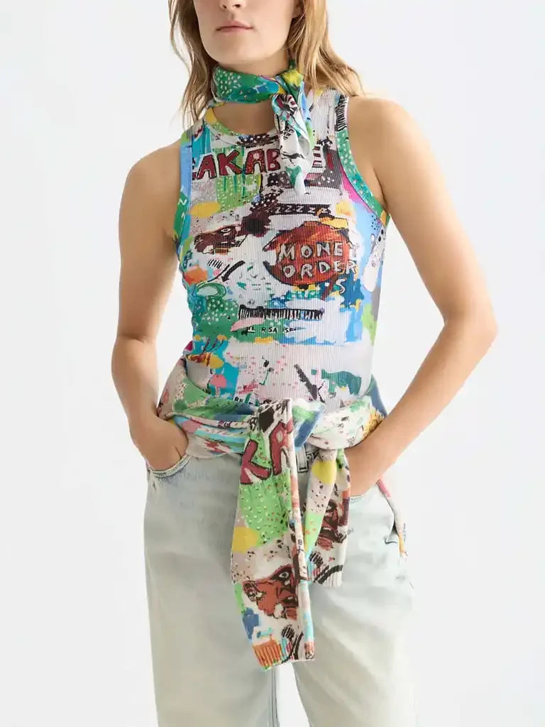 Colorful graphic sleeveless top with neck scarf, paired with light jeans for casual women's fashion
