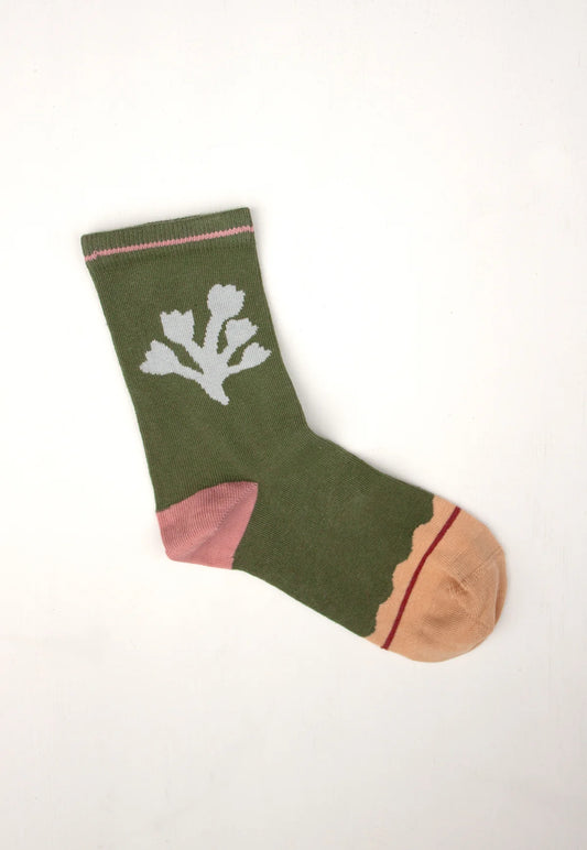 Green NANCYBIRD Nancybird Socks Blossom with a white floral motif and pink and tan accents