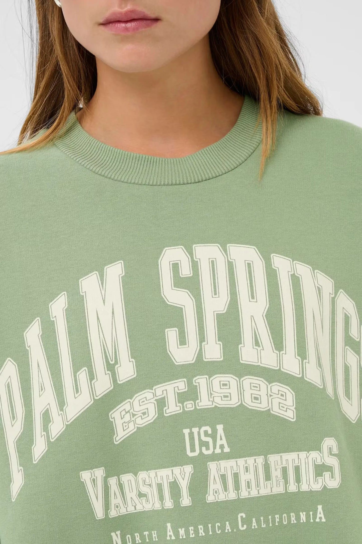Green Palm Spring varsity athletics graphic tee with ribbed neckline, women's fashion