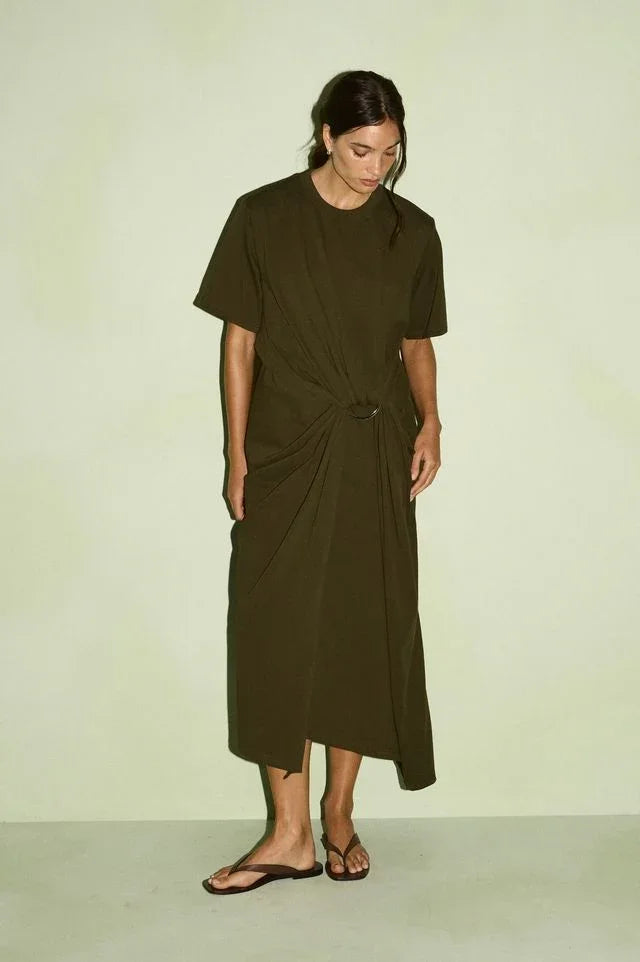 Woman wearing a STAPLE THE LABEL Tovae Draped Midi Tee Dress in olive green.