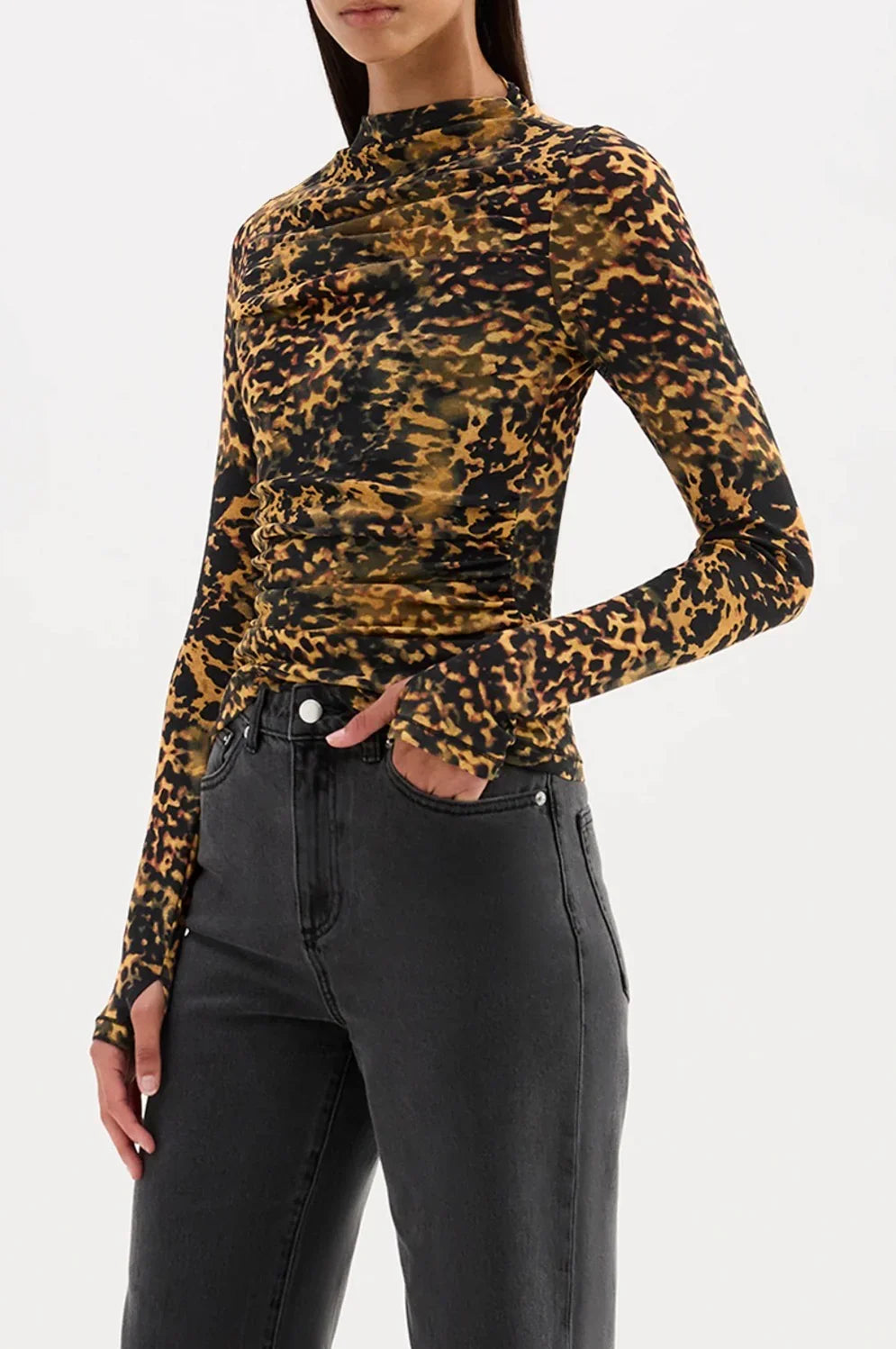 Leopard print long sleeve top with ruched detail, paired with black jeans for women's fashion
