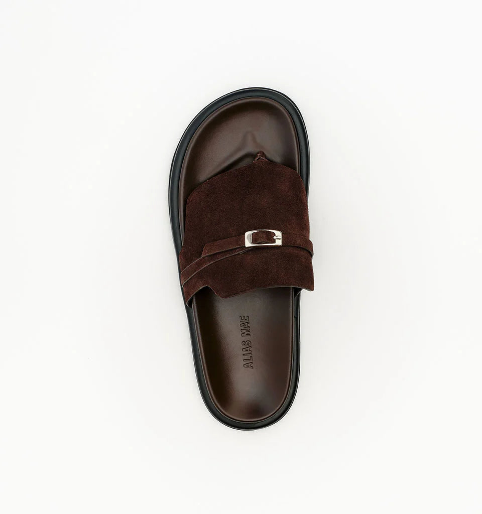 Brown suede slide sandals with silver buckle detail by Alias Mae