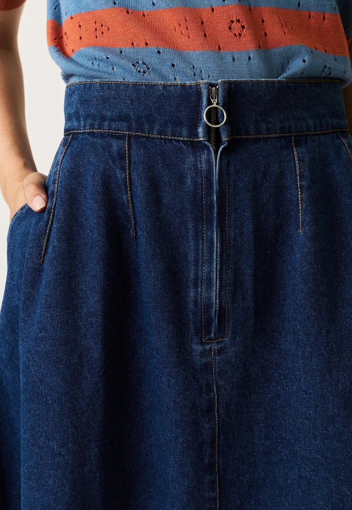 Close-up of the Nancybird Aries Denim Skirt in dark wash featuring a front zip closure.