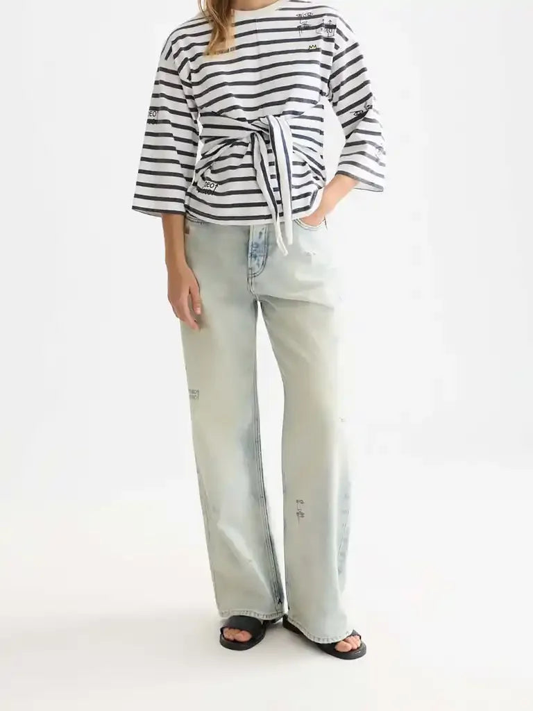 Striped tie-front top with wide-leg jeans and black sandals