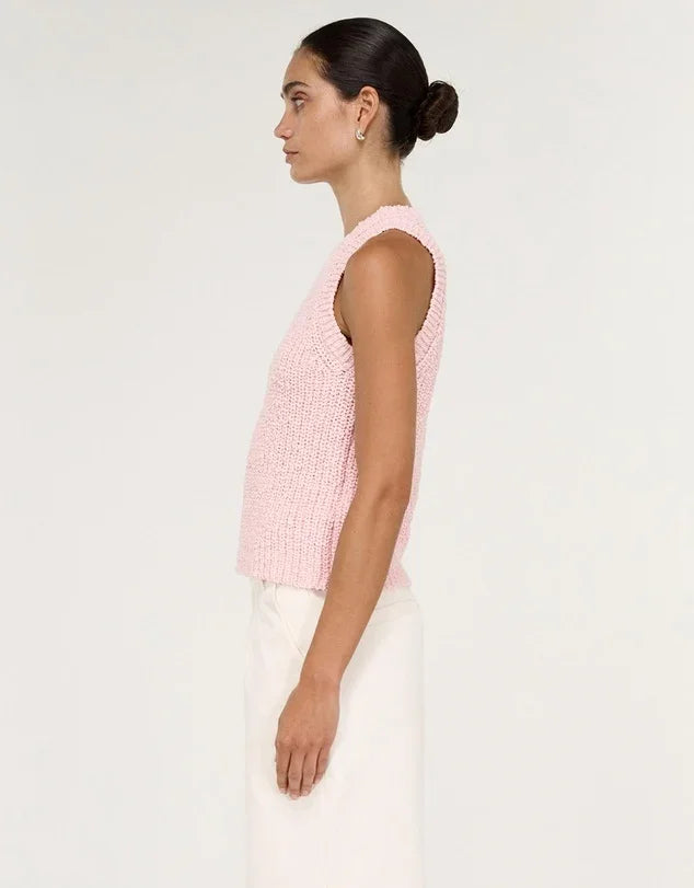 Side view of a woman wearing a STAPLE THE LABEL Cove Knit Tank in Rose Pink.
