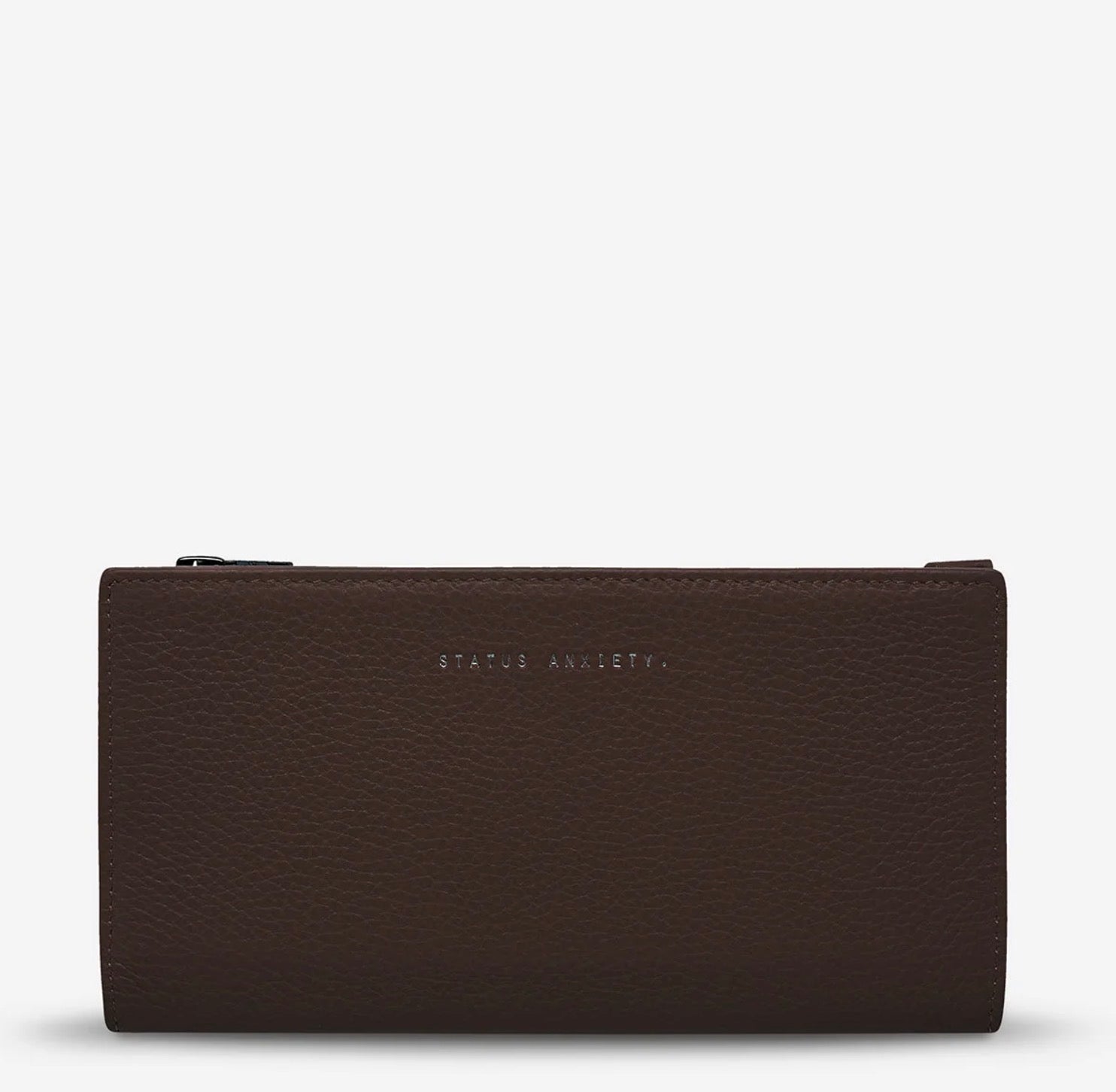 Brown leather wallet with 'STATUS ANXIETY.' embossing, minimalist design for everyday use
