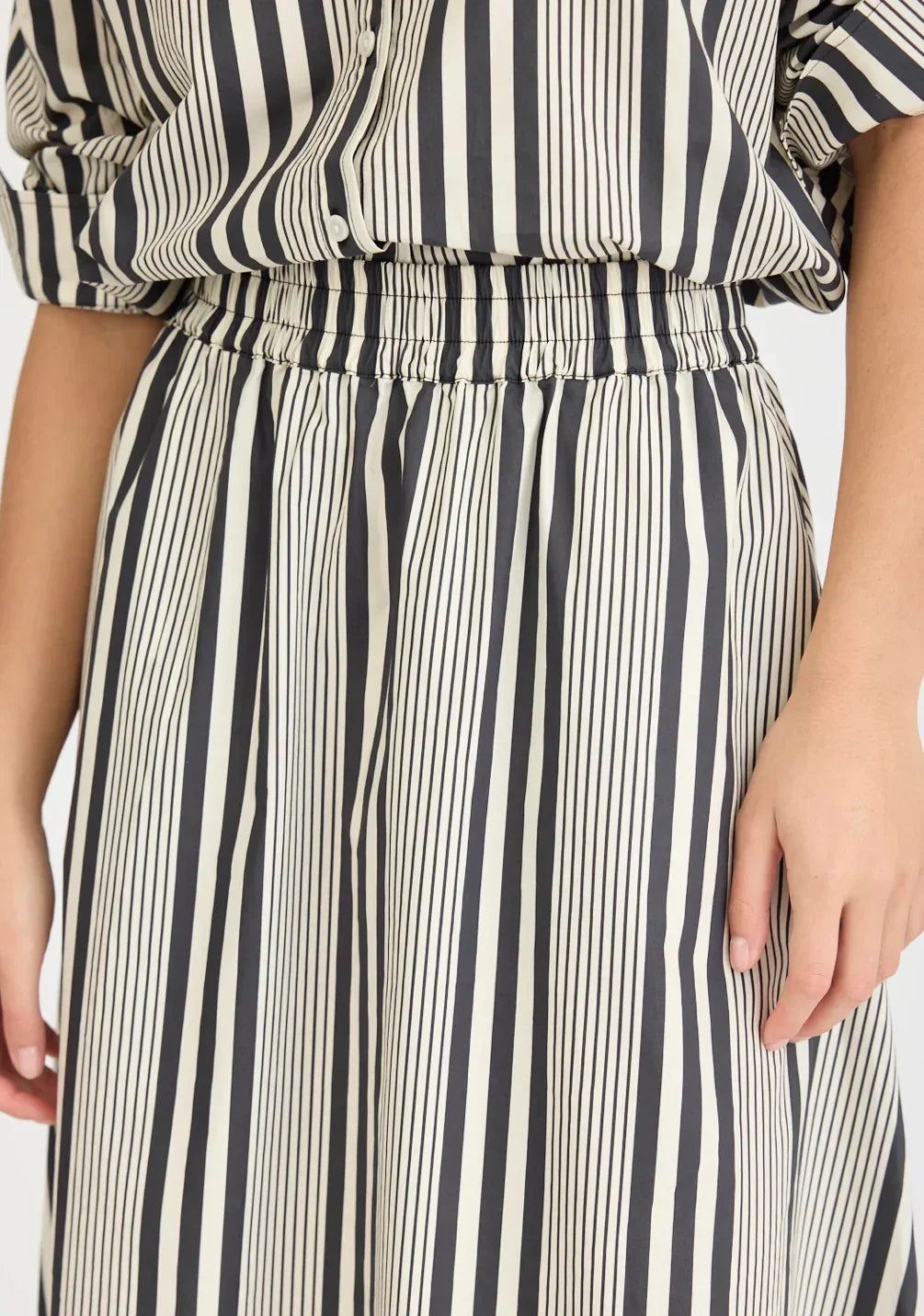 Black and white vertical striped women's fashion skirt at The Tartan Fox boutique