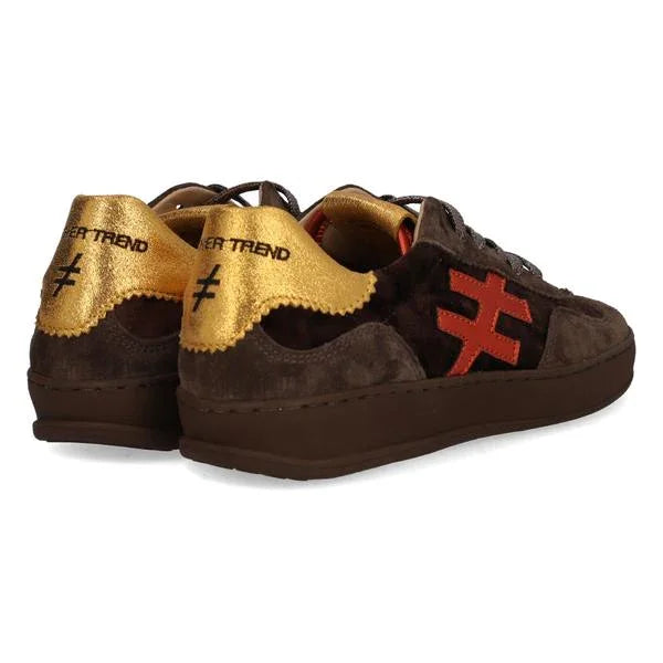 Brown suede sneakers with gold metallic heel, red side detail, and chunky dark sole
