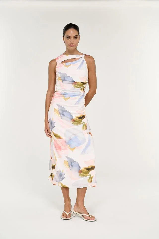 Woman wearing Staple the Label Valea Mesh Midi Dress in  print midi dress with a cutout neckline and white sandals.