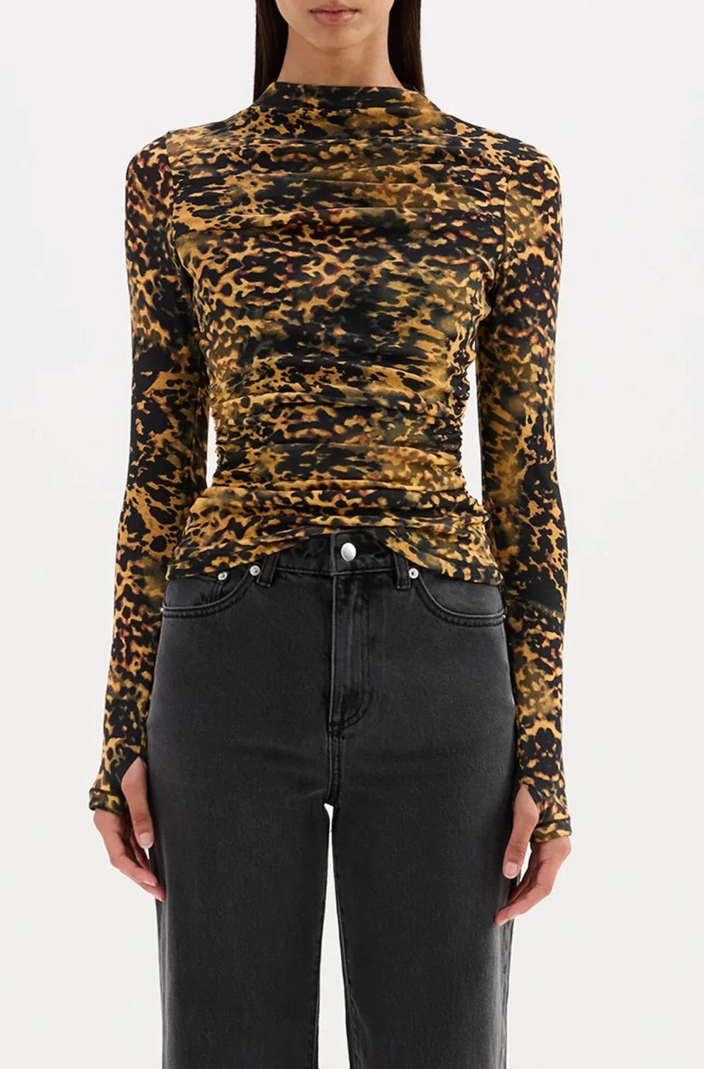 Leopard print long sleeve top with ruched detailing paired with black jeans