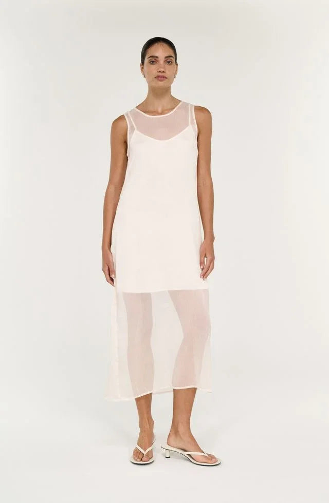 Woman wearing the STAPLE THE LABEL Aria Sheer Layered Midi Dress in cream