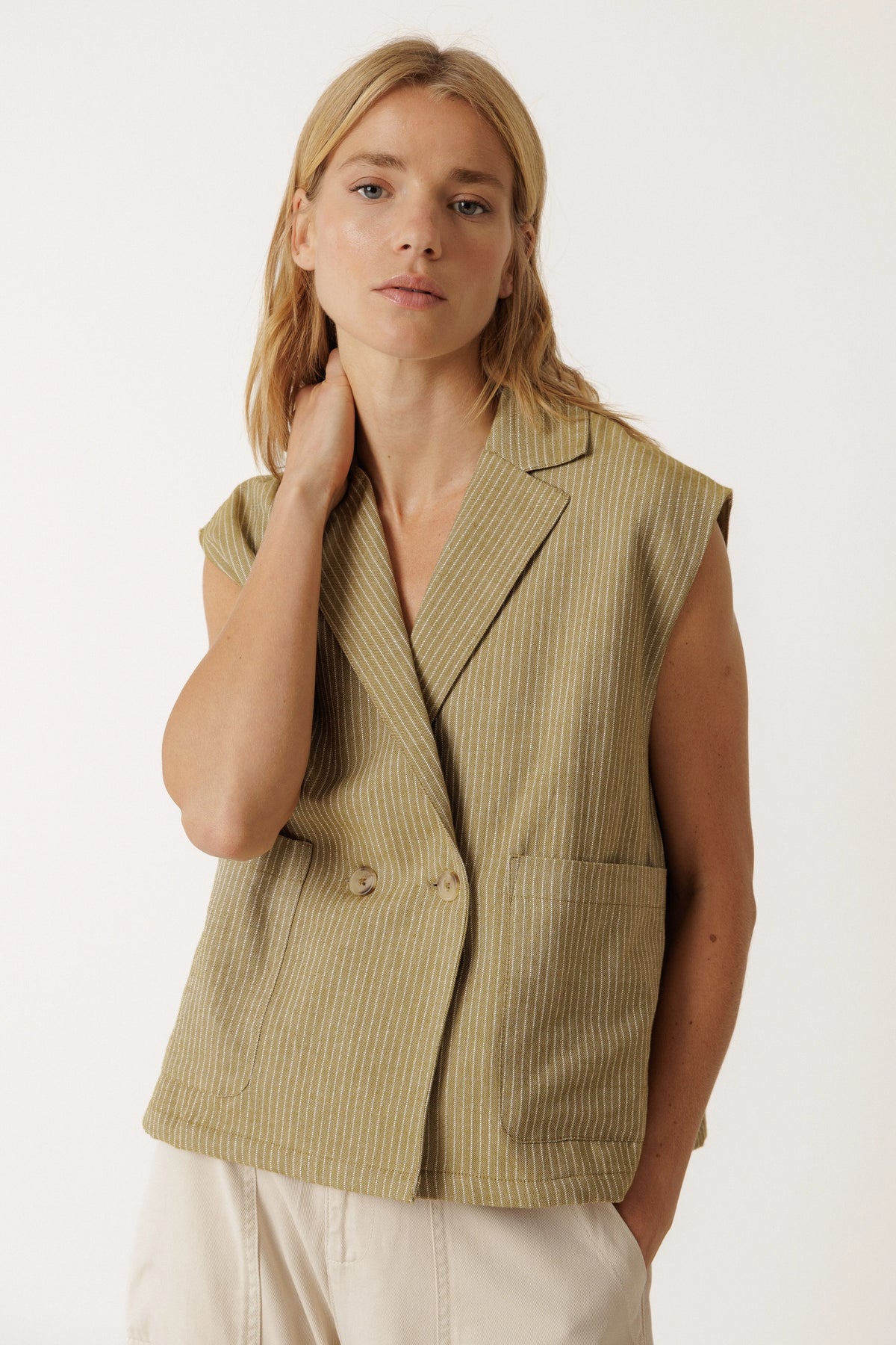 Woman wearing an INDI & COLD Pinstripe Tailored Vest in khaki.