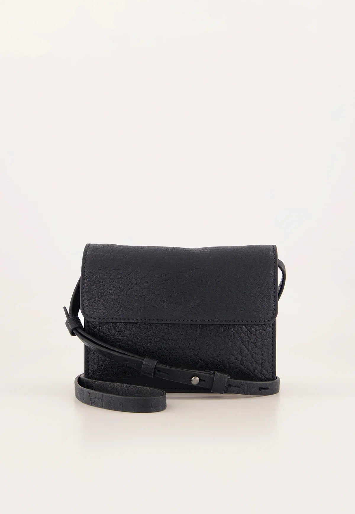 Black textured leather crossbody bag with adjustable strap on neutral background