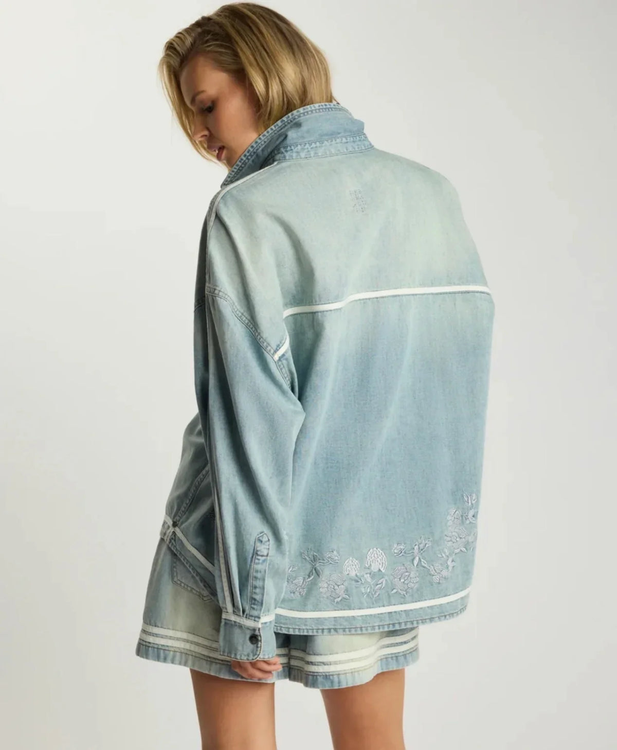 Woman wearing a light blue ONE TEASPOON Folklore Embroidered Shirt from behind