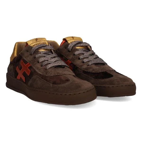 Brown suede low-top sneakers with orange side detail and gold accents for women