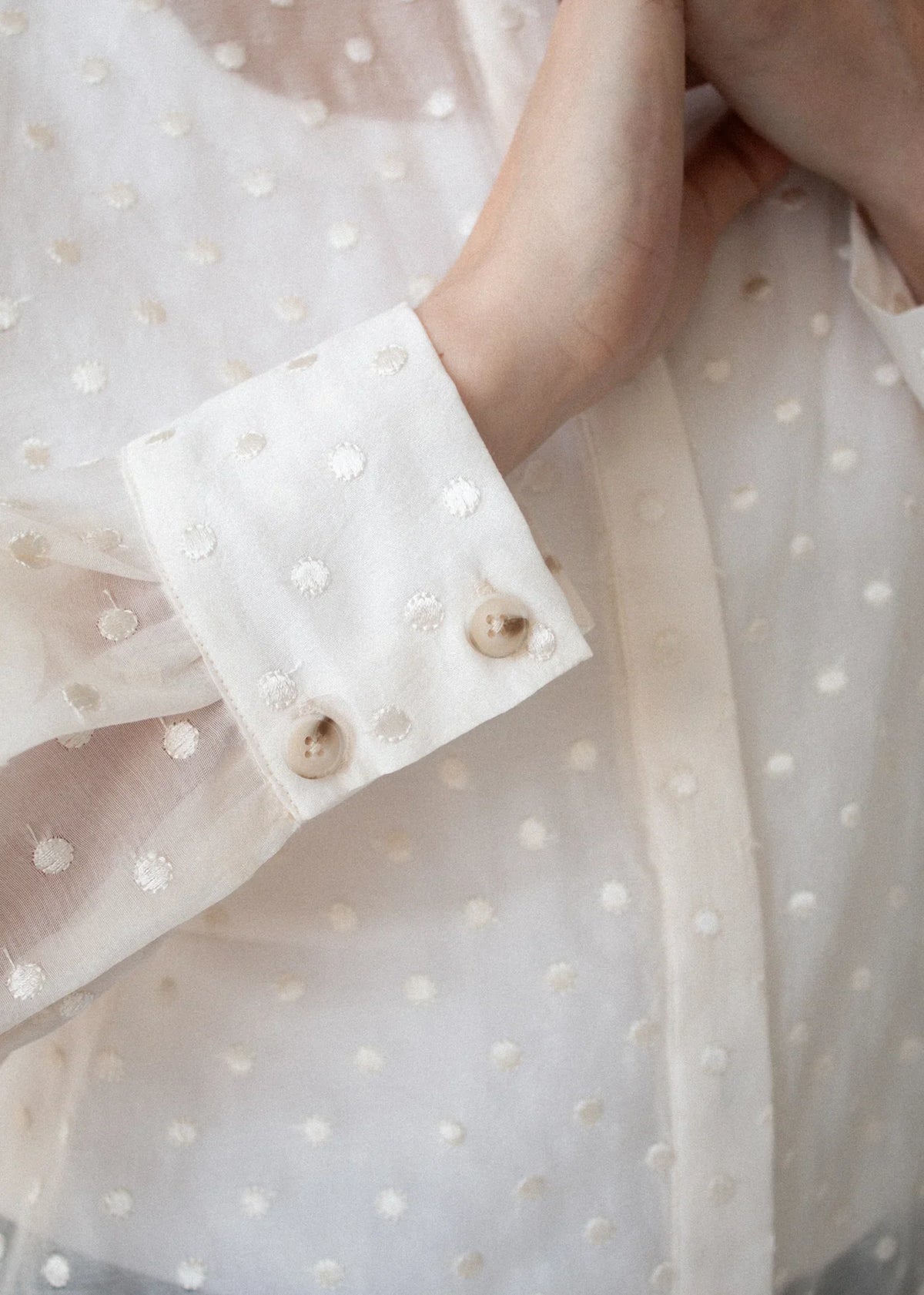 Close-up of the STAPLE THE LABEL Etoile Oversized Shirt in cream spot featuring textured dots.