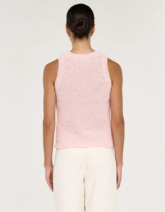 Rear view of a woman wearing the STAPLE THE LABEL Cove Knit Tank in rose pink.