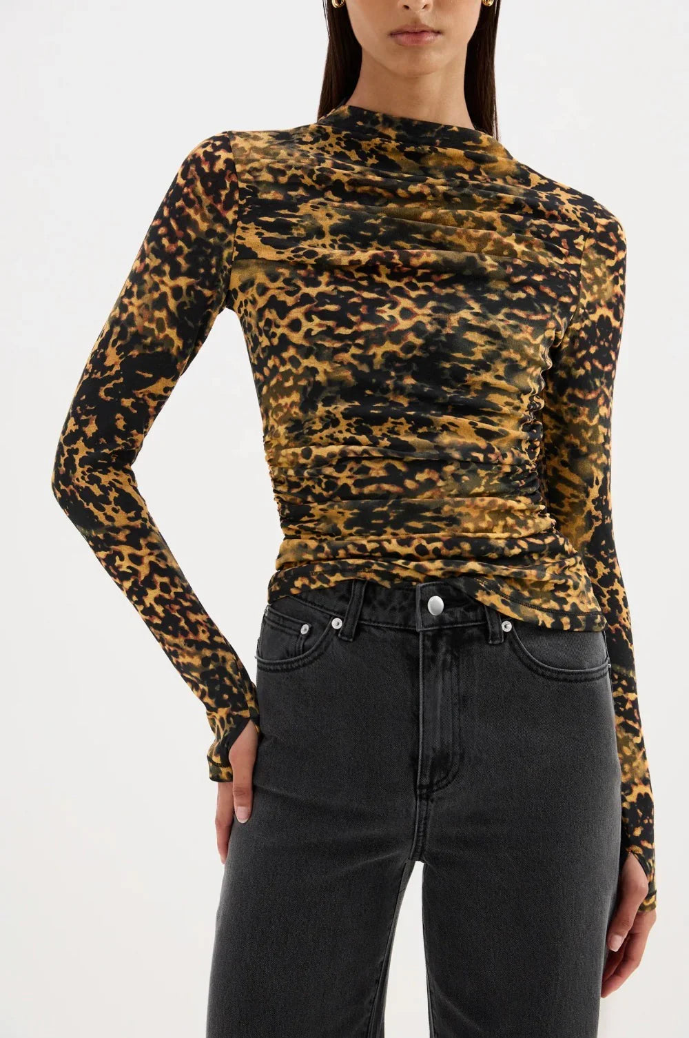 Leopard print long sleeve top with ruched detailing paired with black jeans