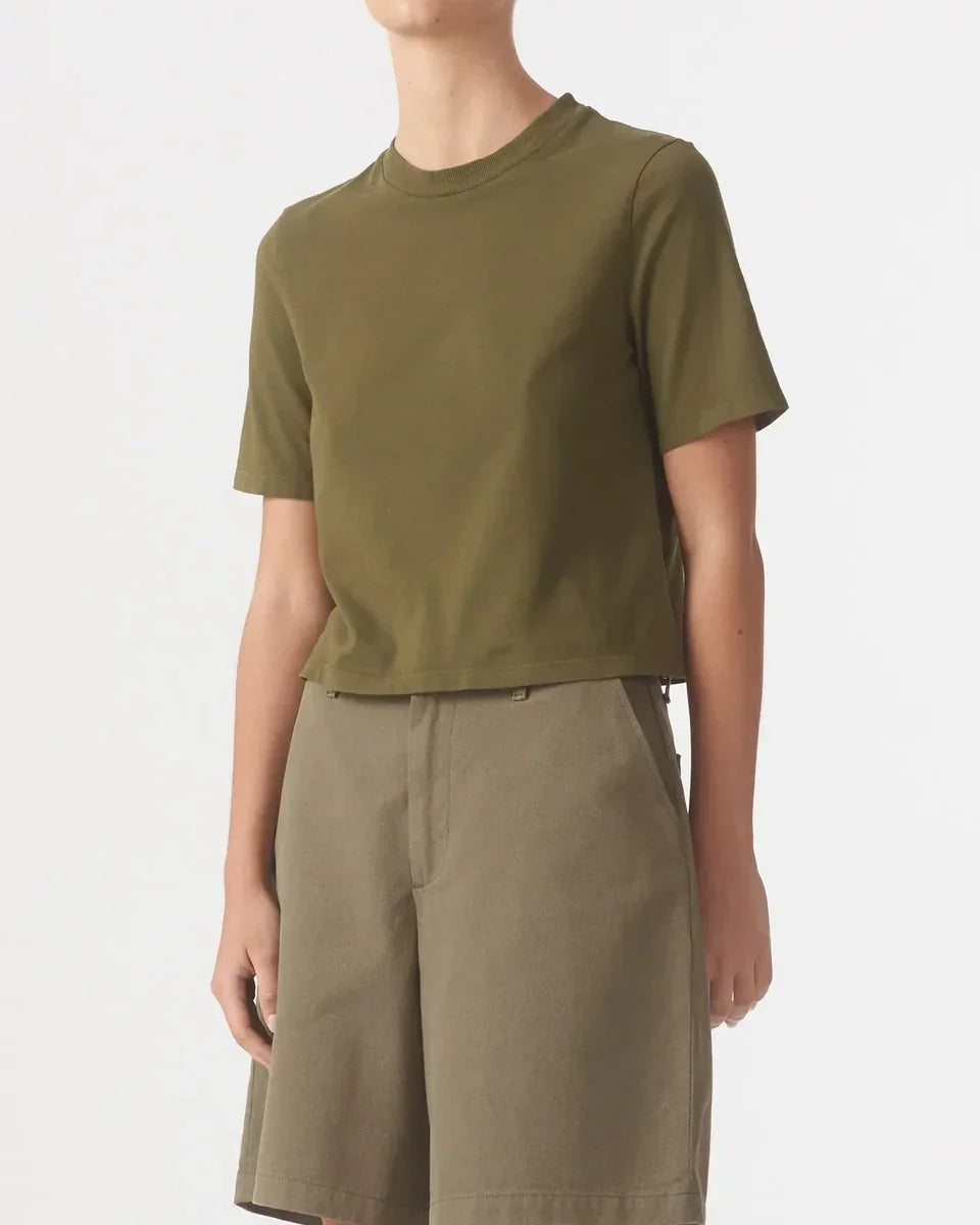 Person wearing a Nobody Denim Jean Tee in Olive paired with matching olive shorts.