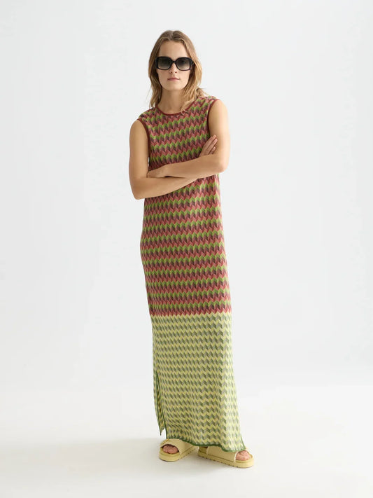 Woman wearing Scotch & Soda Chevron Knitted Maxi Dress in Burnt Henna and sunglasses