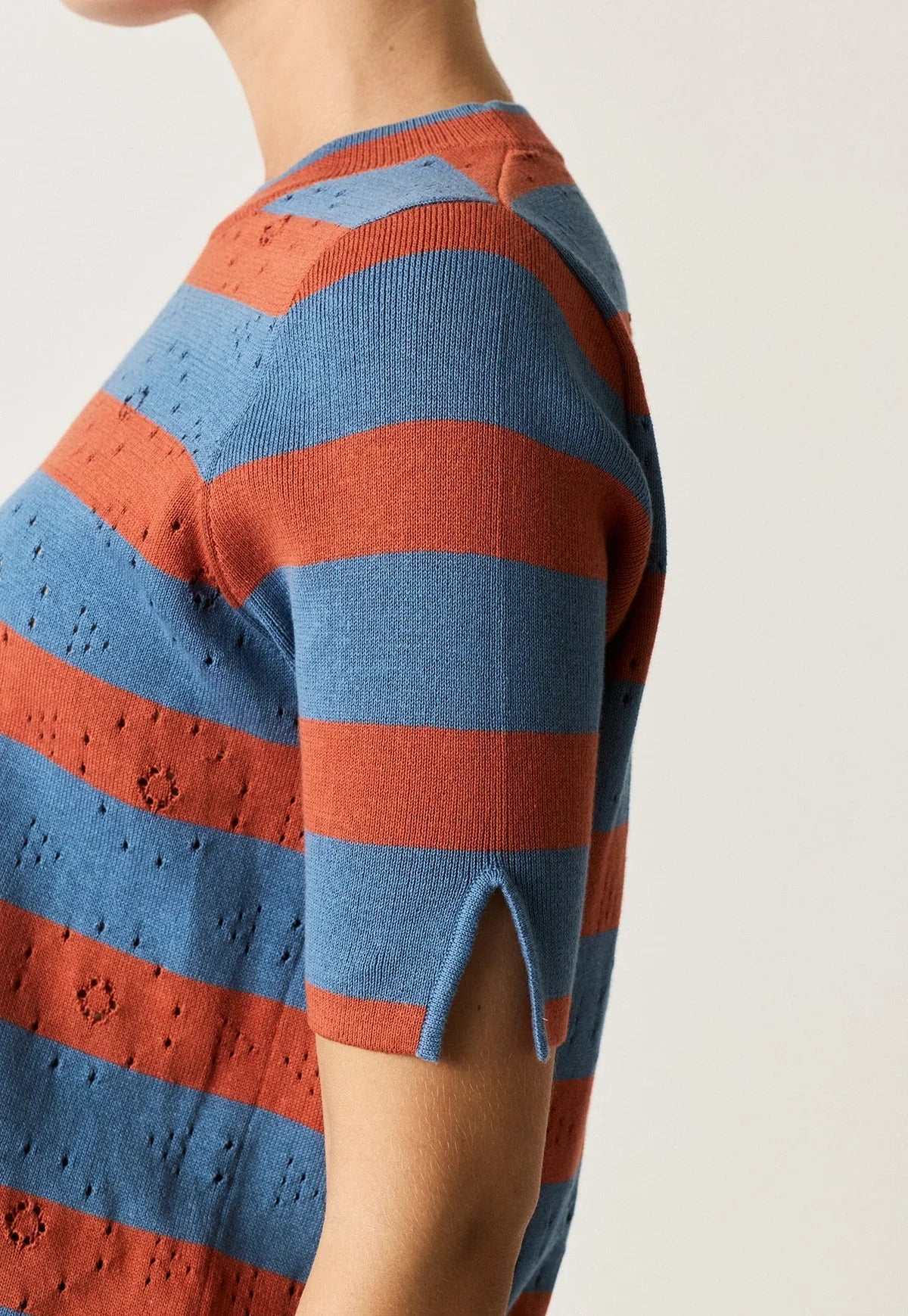 Close-up of the NANCYBIRD Rana Knit Tee in terracotta and blue stripes