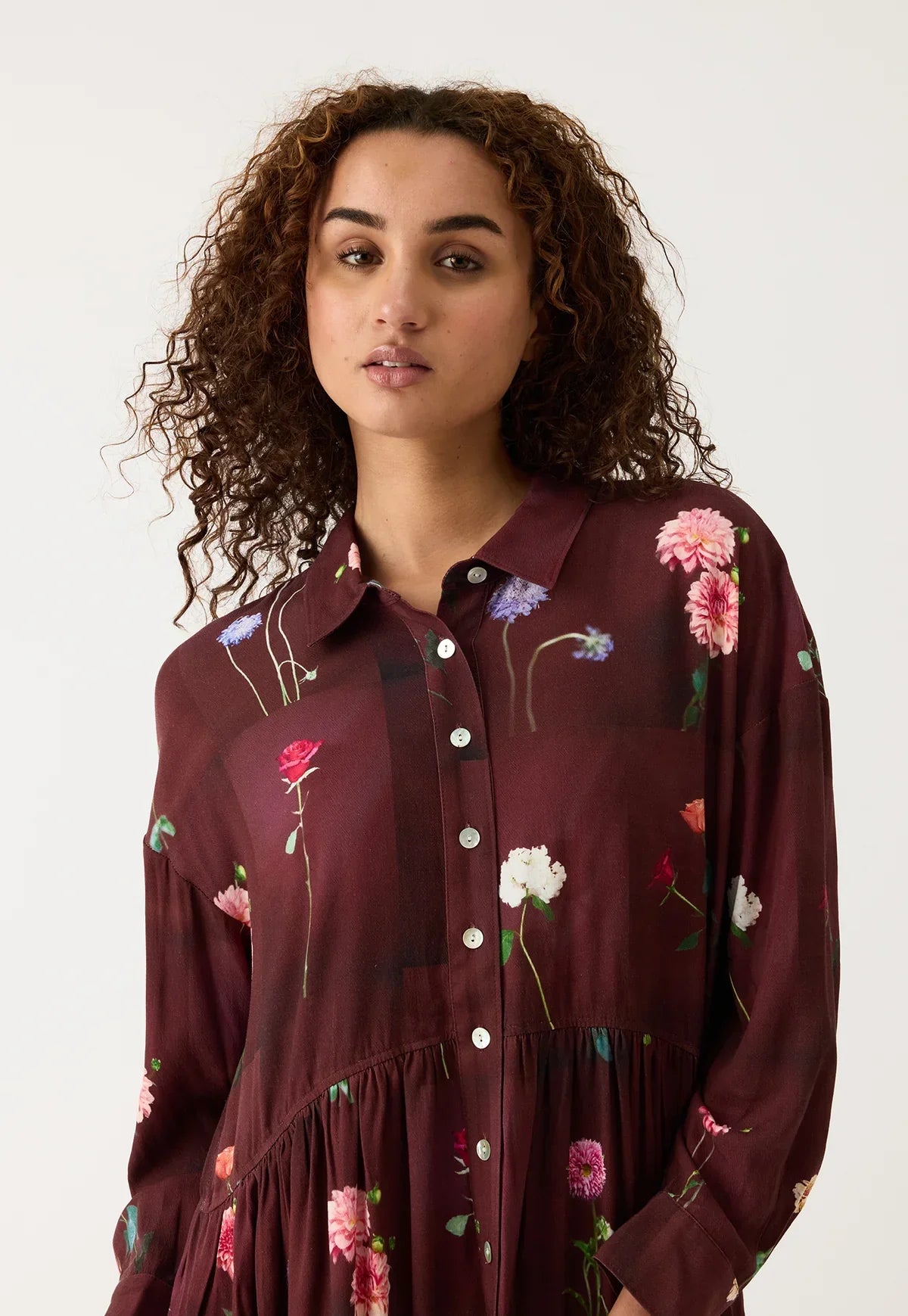 Burgundy floral shirt dress with button front and ruffled hem, perfect for women's fashion
